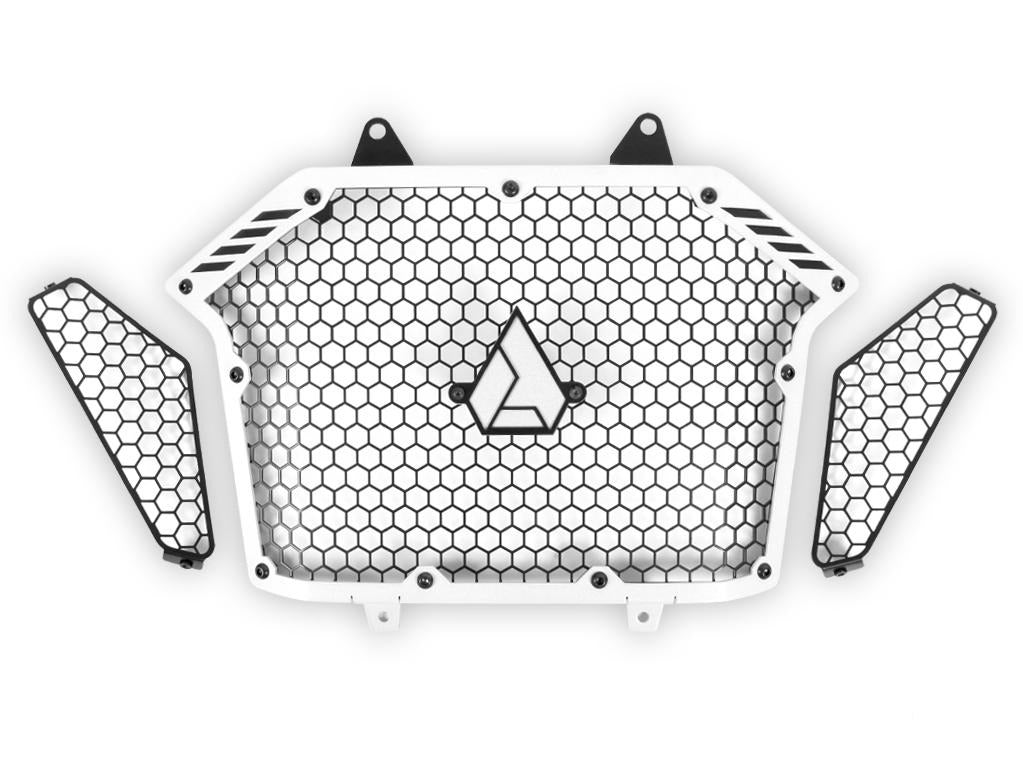 Assault Industries Stinger Grill for RZR Pro XP in frost silver with honeycomb mesh pattern and central logo.