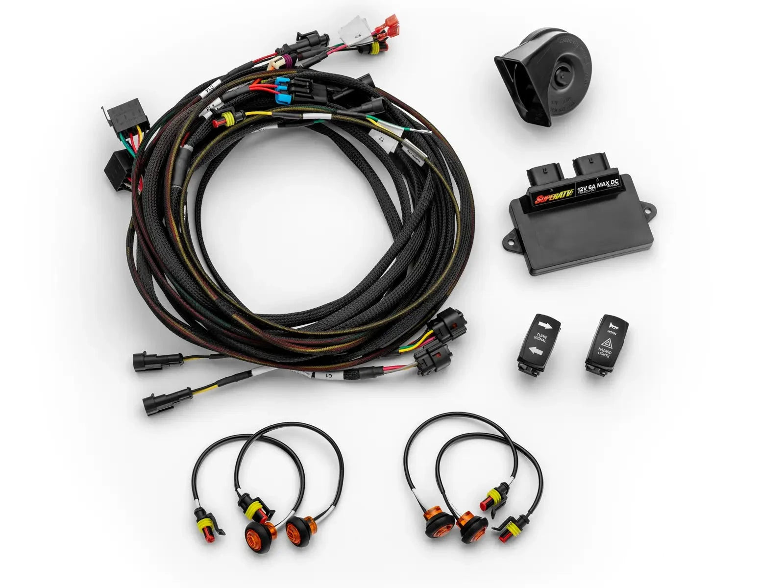 Image of the Can-Am Maverick R Deluxe Self-Canceling Turn Signal Kit, showcasing various components including wiring harnesses, amber LED indicator lights, a horn, an auto-cancel control unit, and rocker switches for turn signals and hazards. The kit is neatly arranged on a white background, highlighting its comprehensive and plug-and-play design.