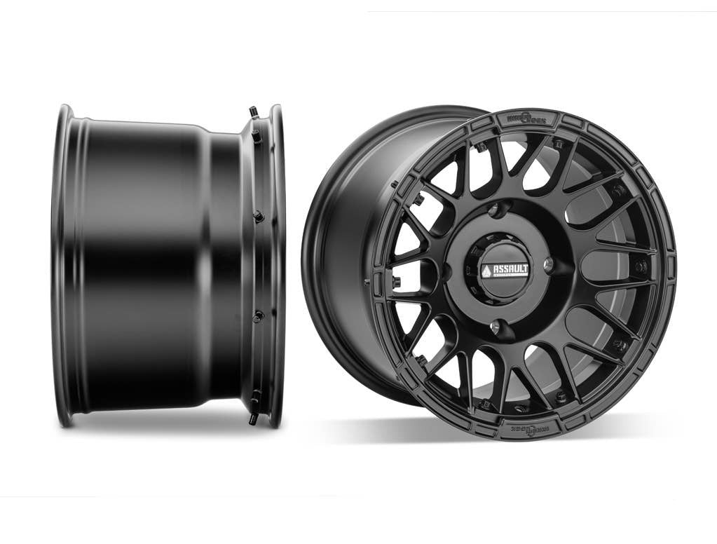 UTV WHEEL FROM ASSAUTL HELLFIRE WHEEL IN 10 INCH WIDE IN BLACK SIDE SHOT SITTING NEXT TO FRONT SHOT ON WHITE BACKGROUND 