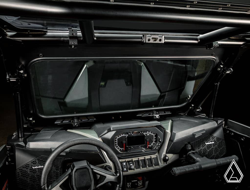 Interior view of a Polaris RZR with an Assault Industries Glass Windshield, showcasing the steering wheel and dashboard.