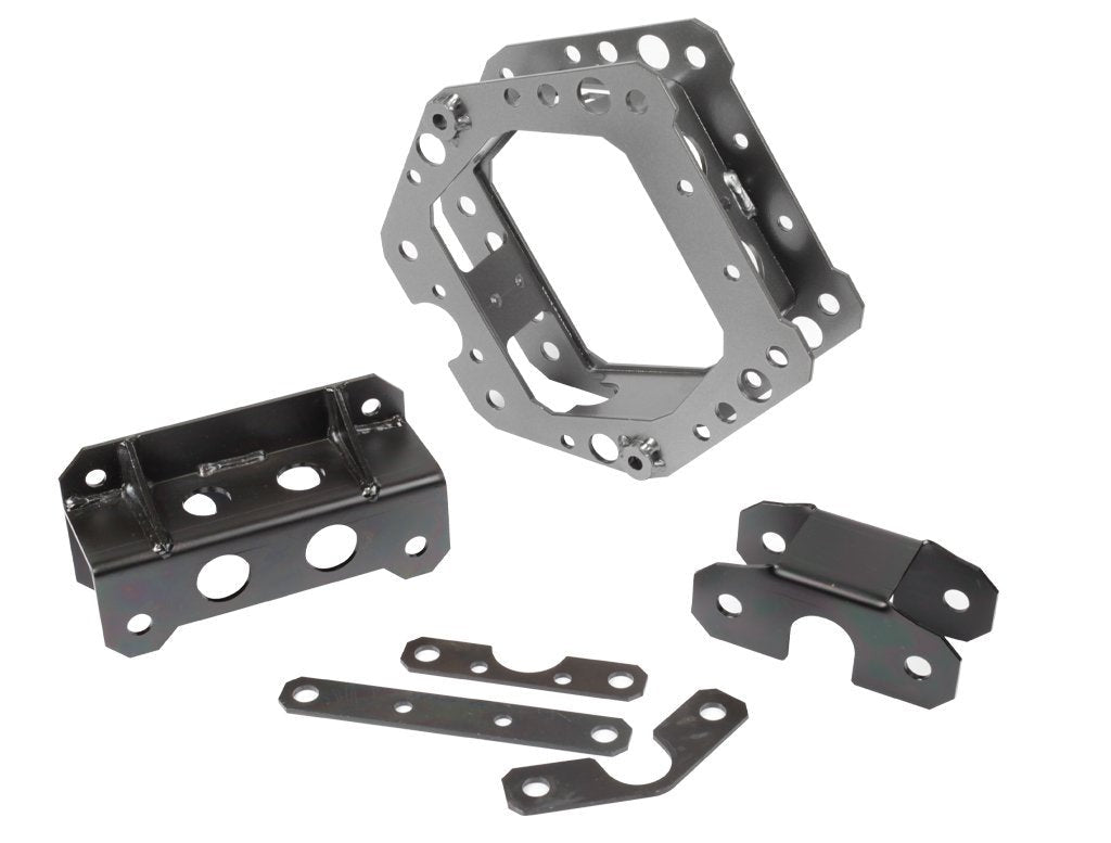 Assault Industries F-22 Front Structural Reinforcement Kit components laid out on a white background, including a main bracket, two support brackets, and connecting plates, all in a dark carbon powder-coated finish.